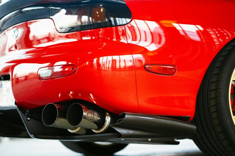 Performance back box with twin tailpipes on sports car