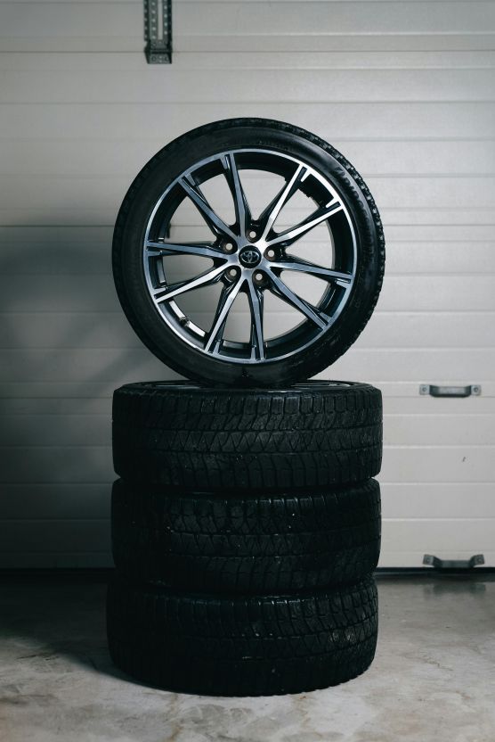 Stack of repaired alloy wheels at Reid Works